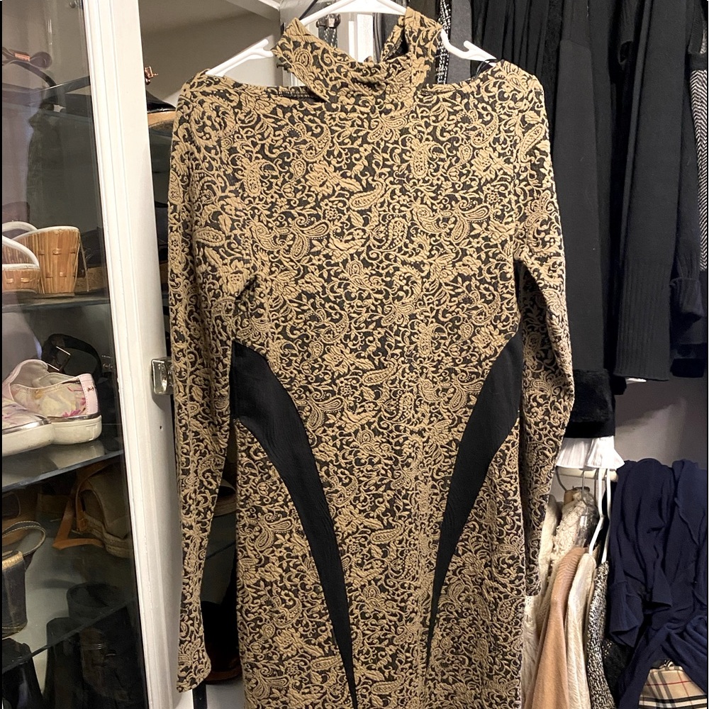 NWOT Free People bodycon dress with high neck and open back.